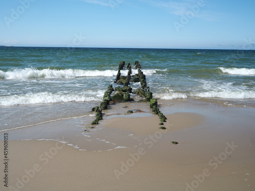 Wooden brakwater in a stormy sea.  photo