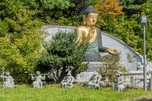 Large bronze seated Buddha at Buddhist temple.