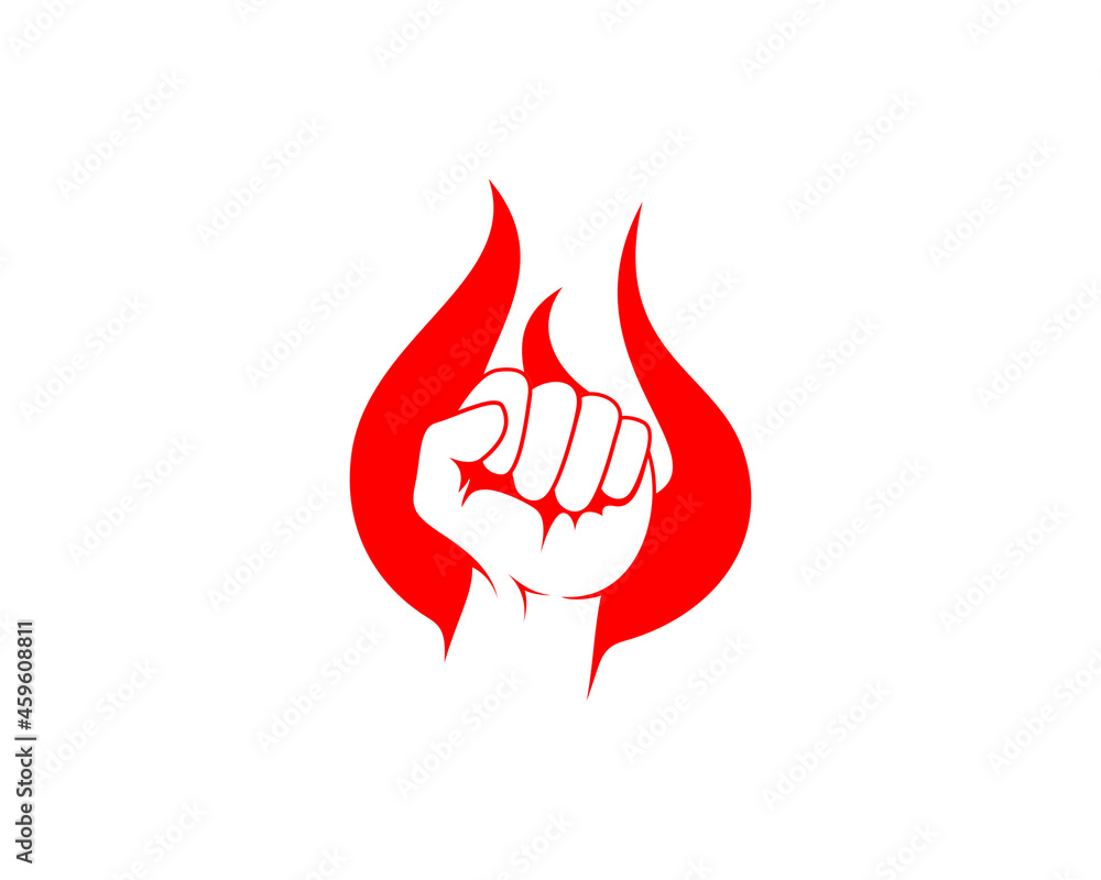 Fist hand silhouette in the fire flame Fist hand silhouette in the fire flame