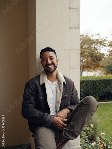 Latinx man laughing 