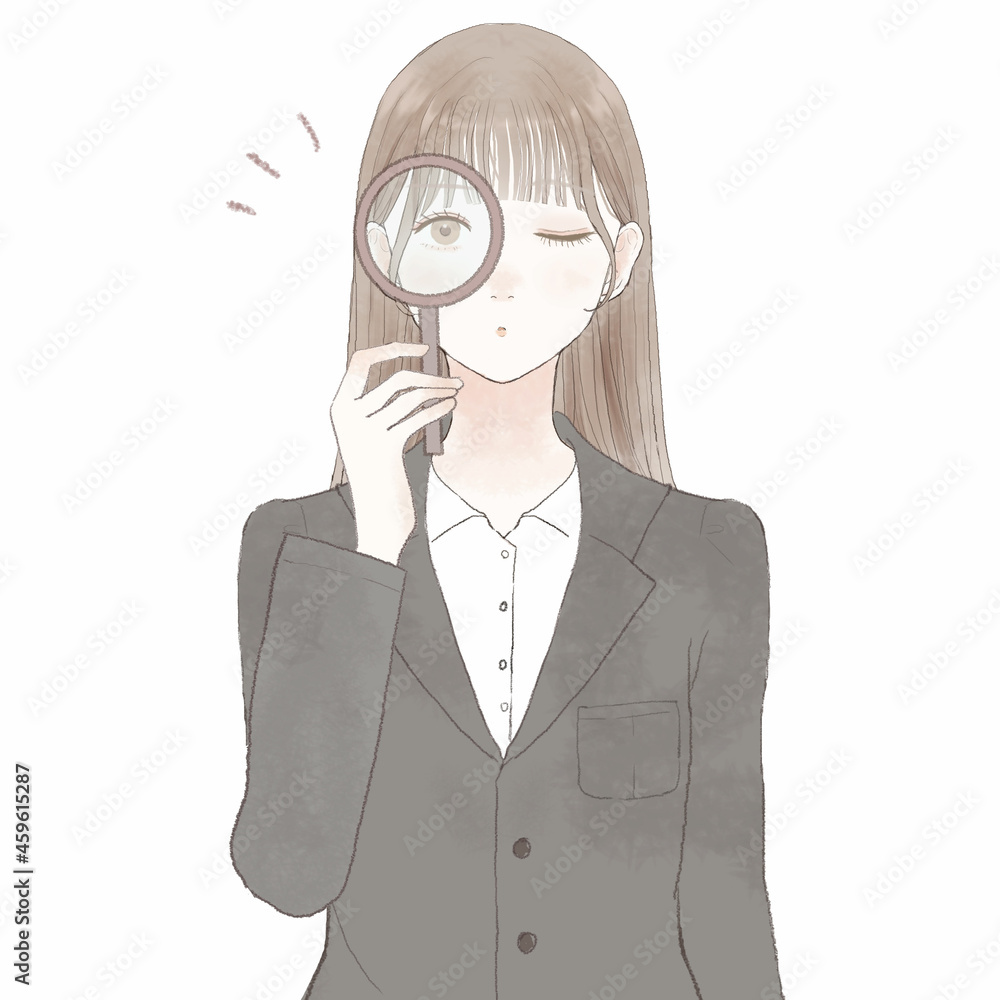 ルーペを使ってチェックしているスーツを着た女性