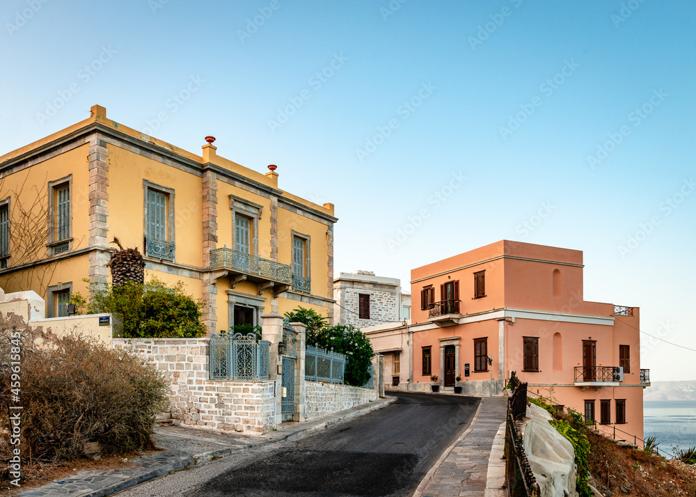 Old neoclassical mansions facing the Aegean Sea in the historic Vaporia neighbourhood in Ermoupolis, the capital of Syros Island. Cyclades, Greece.