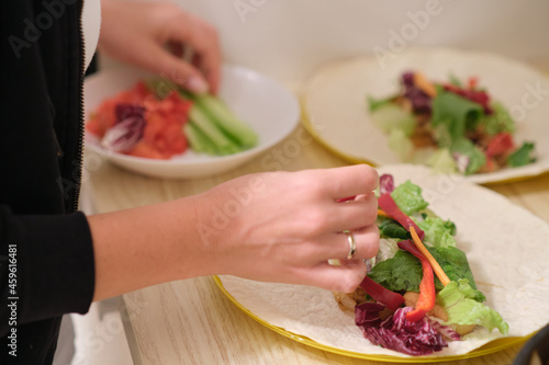 Person preparing healthy dinner at home, focus on food