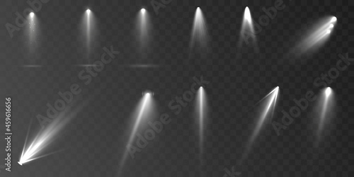 Spotlights set isolated on transparent background. Vector glowing light effect with golden rays and lens flares.	