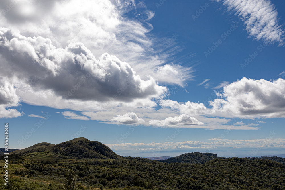 Fototapeta premium landscape with mountains and clouds at bright day