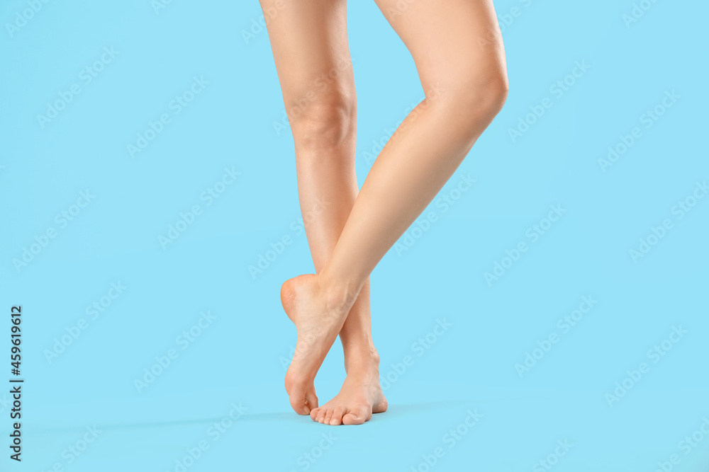 Legs of beautiful woman on color background Legs of beautiful woman on color background