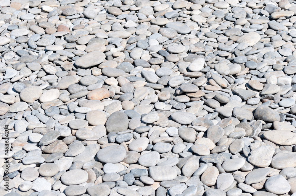 a pebble beach. pebbles on the beach close-up. clean pleasant pebbles of the beach. a pebble beach. pebbles on the beach close-up. clean pleasant pebbles of the beach.
