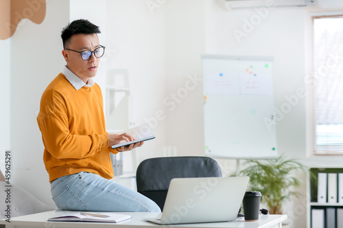 Asian teacher conducting le...