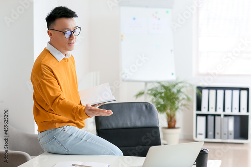 Asian teacher conducting le...