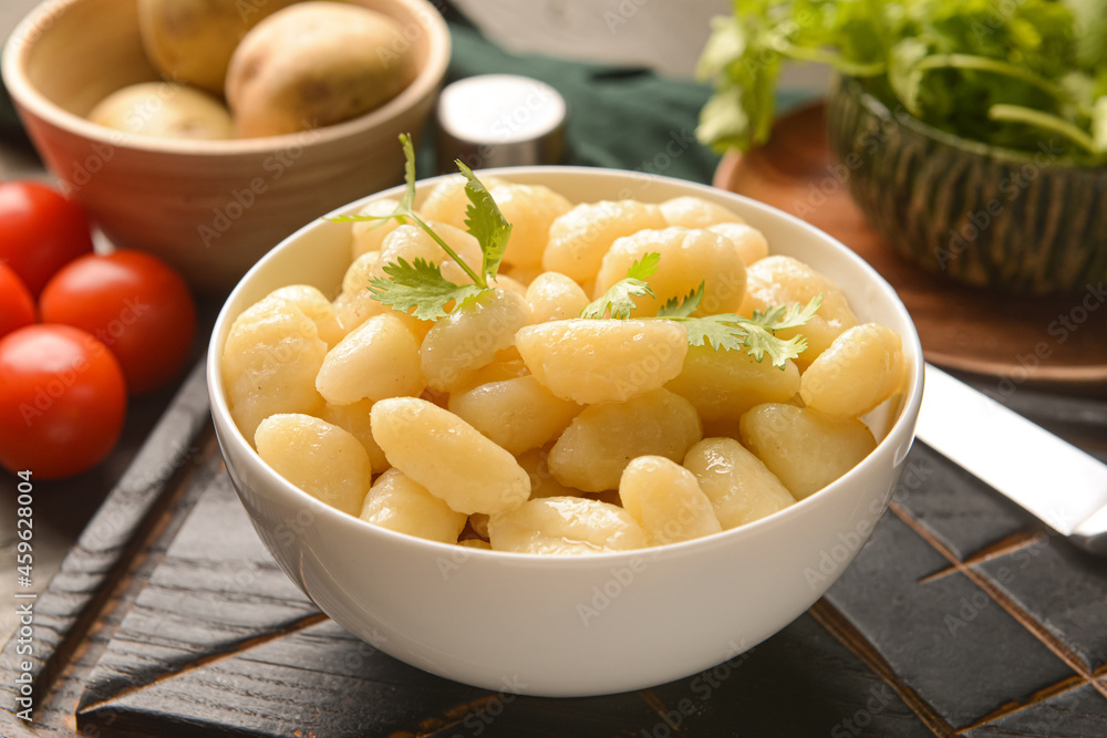 Bowl with tasty gnocchi on table Bowl with tasty gnocchi on table