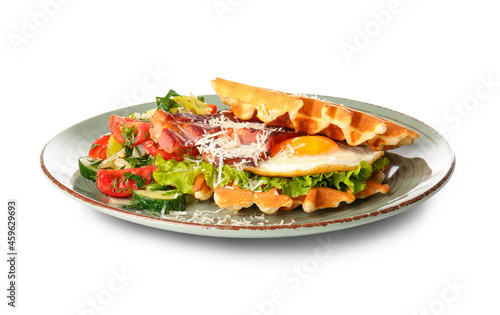 Delicious Belgian waffles with egg  bacon and vegetables on white background
