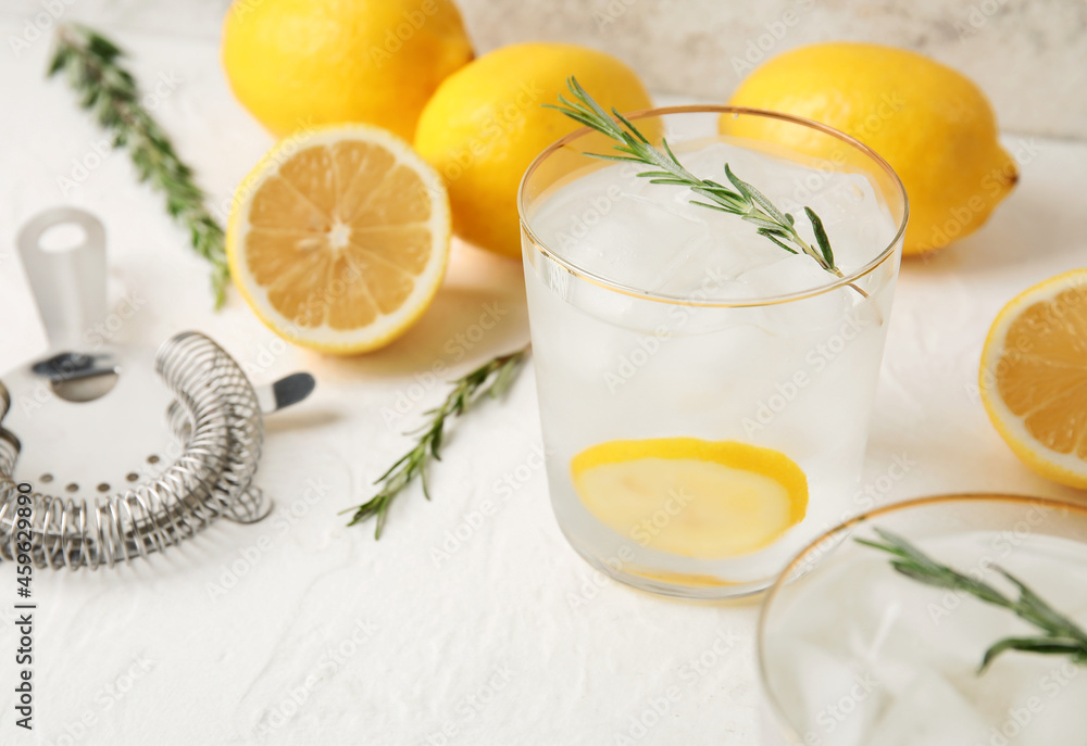 Glasses of cold gin tonic on light background Glasses of cold gin tonic on light background
