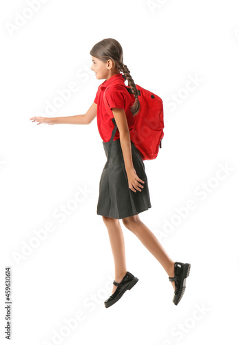 Jumping schoolgirl on white...