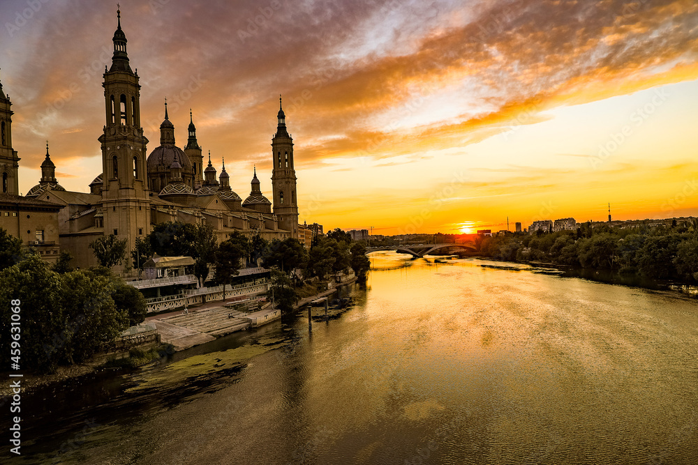 picturesque sunset on a summer day in the city of Zaragoza in Spain overlooking the river and the cathedral
