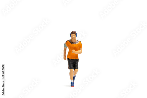 Miniature people, Man in fitness wear running on white background and space for text © Sirichai Puangsuwan