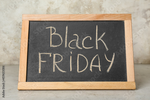 Chalkboard with text BLACK FRIDAY on light background © Pixel-Shot