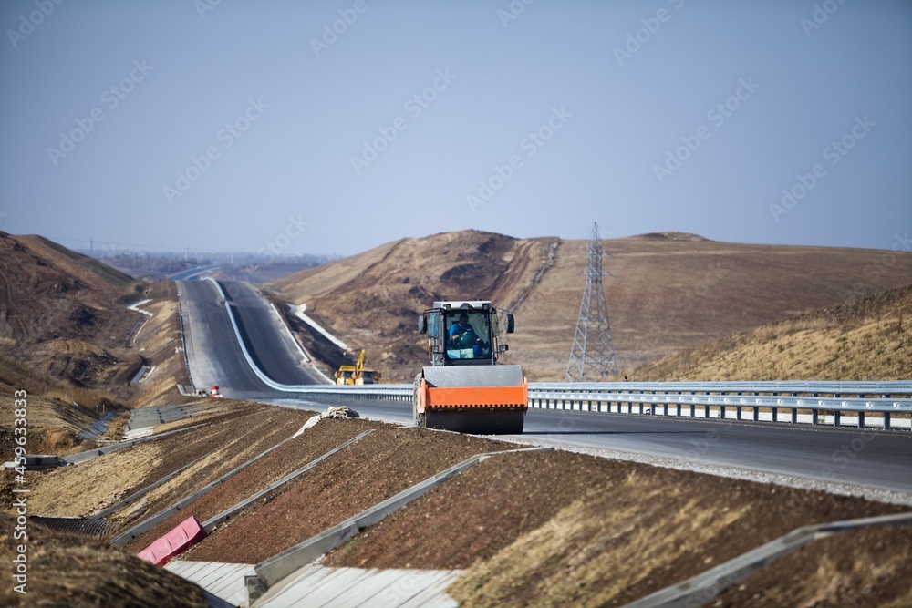 Construction site with excavator machine on on road background Construction site with excavator machine on on road background