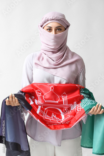 Muslim woman with flag of A...