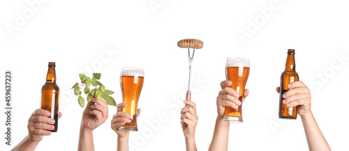 Hands with beer and snack on white background
