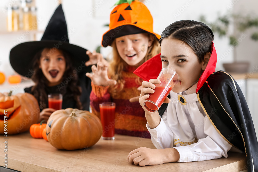 Cute little children celebrating Halloween at home Cute little children celebrating Halloween at home