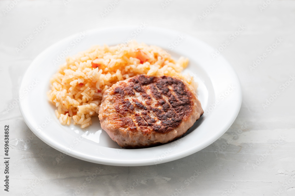 boiled rice with tomato and spices on white dish boiled rice with tomato and spices on white dish