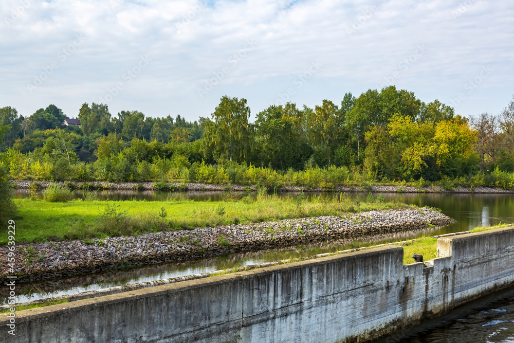Fototapeta premium View of the picturesque river and wooded autumn coast