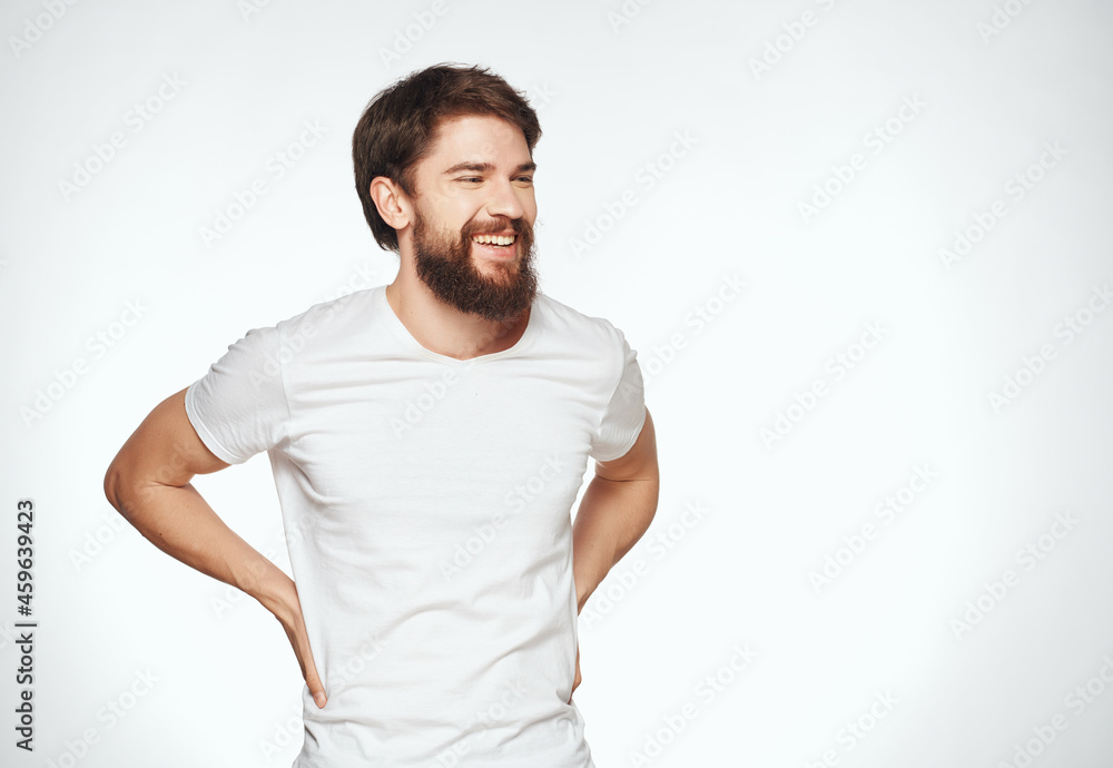 bearded man in a white t-shirt expressive look discontent Studio bearded man in a white t-shirt expressive look discontent Studio