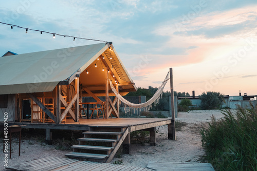 Glamping tent in the forest. Luxury tent sea view. Nature green tourism photo