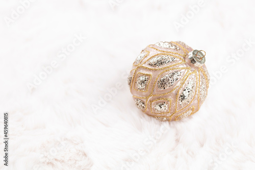 Golden christmas balls with wool background.
