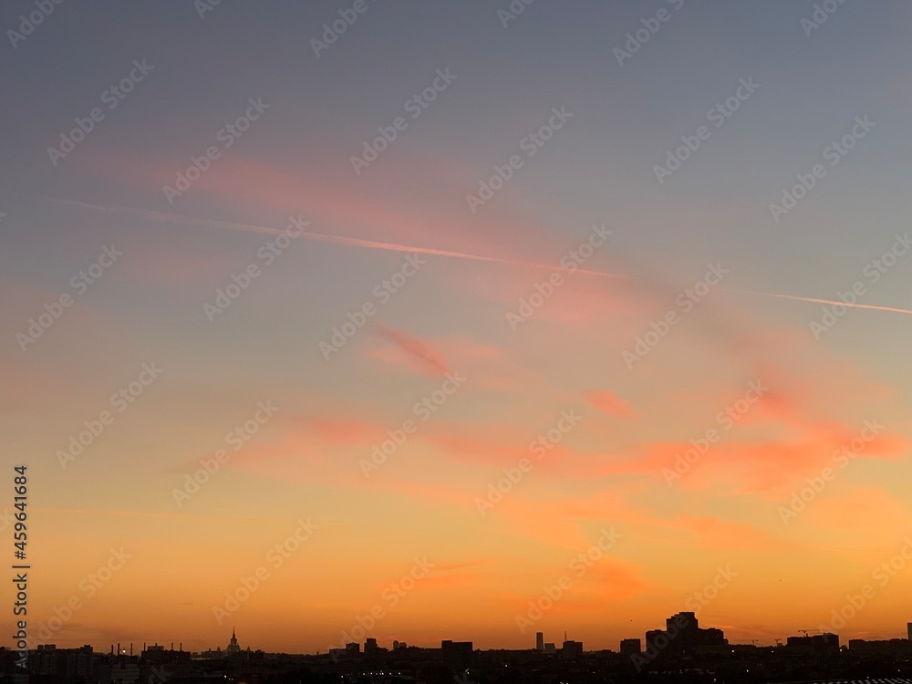 Clouds and sky in different situations and colors. Romantic mood. City buildings and monuments on the background of the sky. City sky. Pink and orange clouds. Sky at sea, sunsets and sunrises.