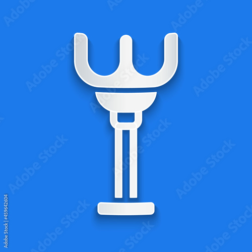 Paper cut Rake toy icon isolated on blue background. Children toy for beach games. Paper art style. Vector