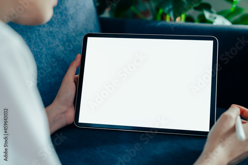 Woman hand using digital tablet and the screen is blank.