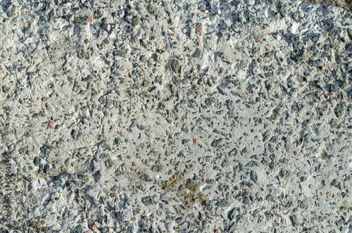 Φωτογραφία Light grey cement with small stones texture
