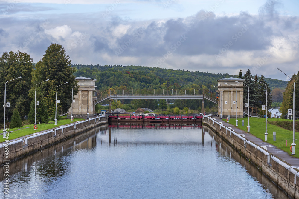 An old gateway on the Moscow Canal for adjusting the water level in the riverbed. A suburb of the capital. Moscow region, Russia An old gateway on the Moscow Canal for adjusting the water level in the riverbed. A suburb of the capital. Moscow region, Russia