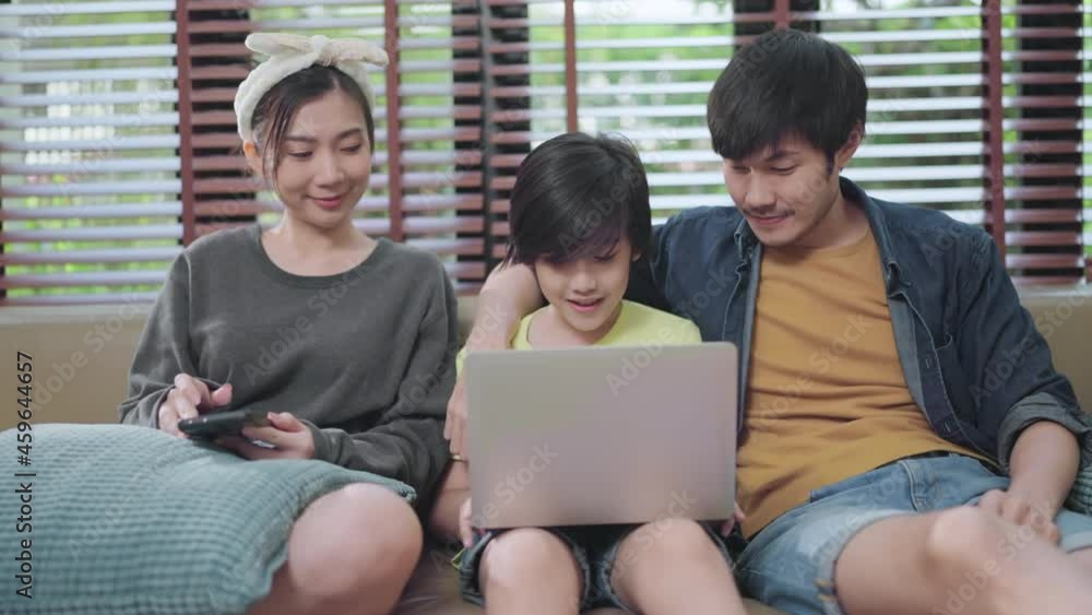 Asian family sit relax positive conversation with son, happiness smile boy casual talking with his parent,Happy Asian family enjoy holiday together at sofa, home sweet home living room Asian family sit relax positive conversation with son, happiness smile boy casual talking with his parent,Happy Asian family enjoy holiday together at sofa, home sweet home living room