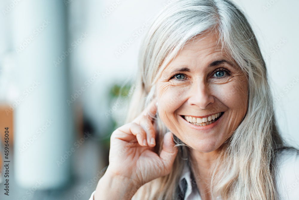 Happy mature woman with gray hair in cafe Happy mature woman with gray hair in cafe