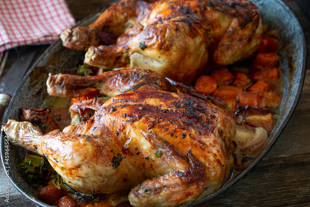 Naklejka premium Roast poultry with root vegetable
