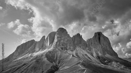 subtle black and white landscape scene of Sasso Lungo Mountain Range with looming storm clouds over the jagged peaks near Sella Pass in Dolomites, Italy, South Tyrol