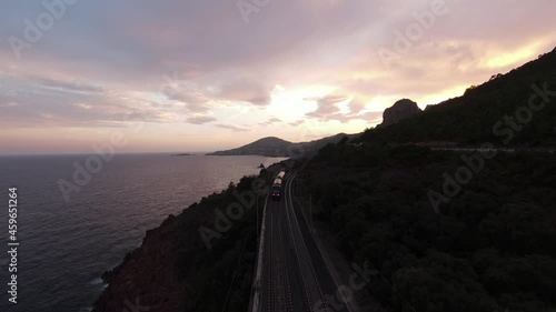 aerial image of a train traveling on the seaside photo