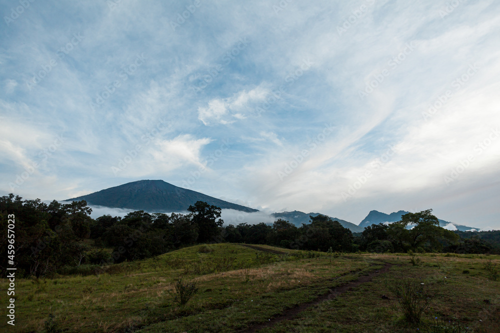 Beautiful landscape of mount Rinjani surrounded by clouds, Lombok, Indonesia