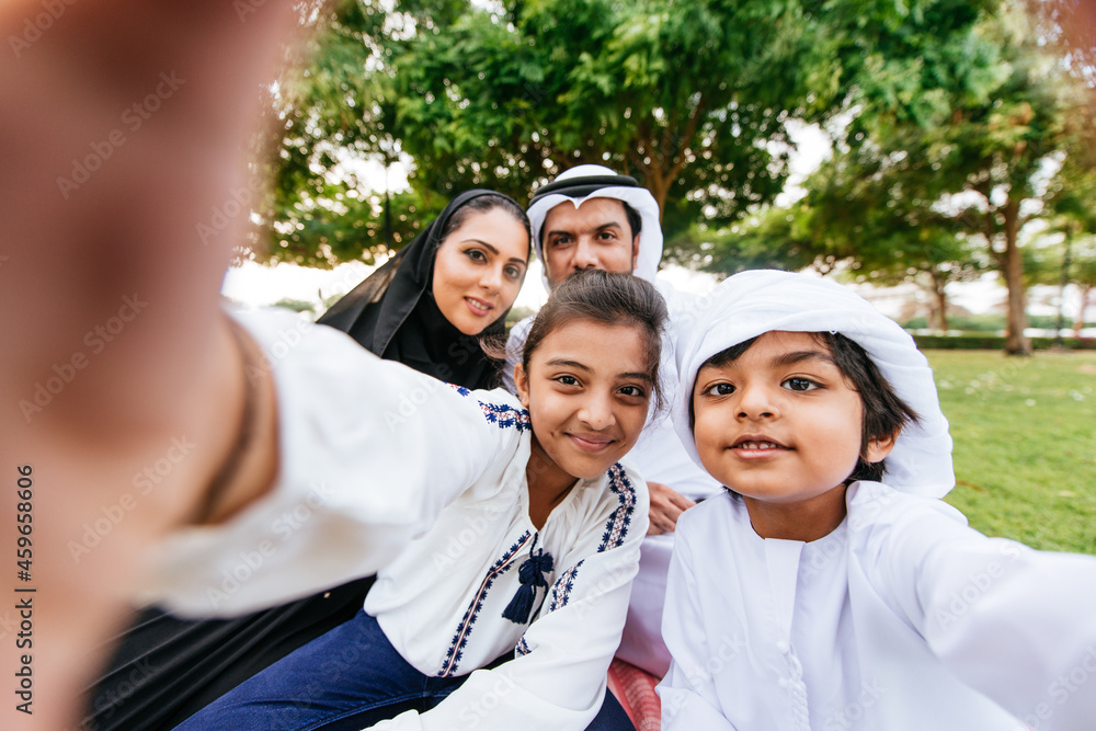 Fototapeta premium Happy family spending time together outdoor in Dubai