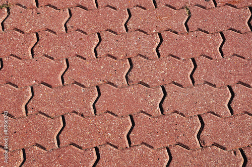Background, design, wallpaper, texture of curly paving slabs. The tile is pink.