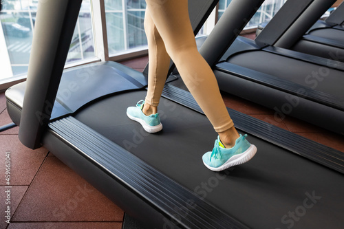 Fitness woman walking and running in the treadmill