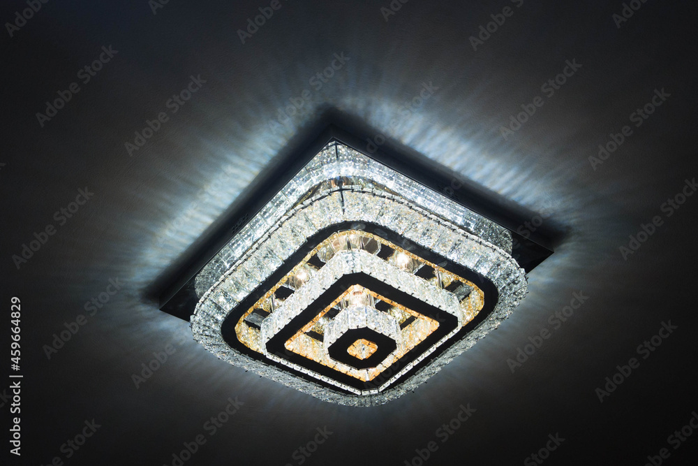 A big Crystal Chandelier with full of lights, Beautiful glass Chandeliers background. Sureal chandelier emitting magical light . Rectangular chandelier with remote control . A big Crystal Chandelier with full of lights, Beautiful glass Chandeliers background. Sureal chandelier emitting magical light . Rectangular chandelier with remote control .