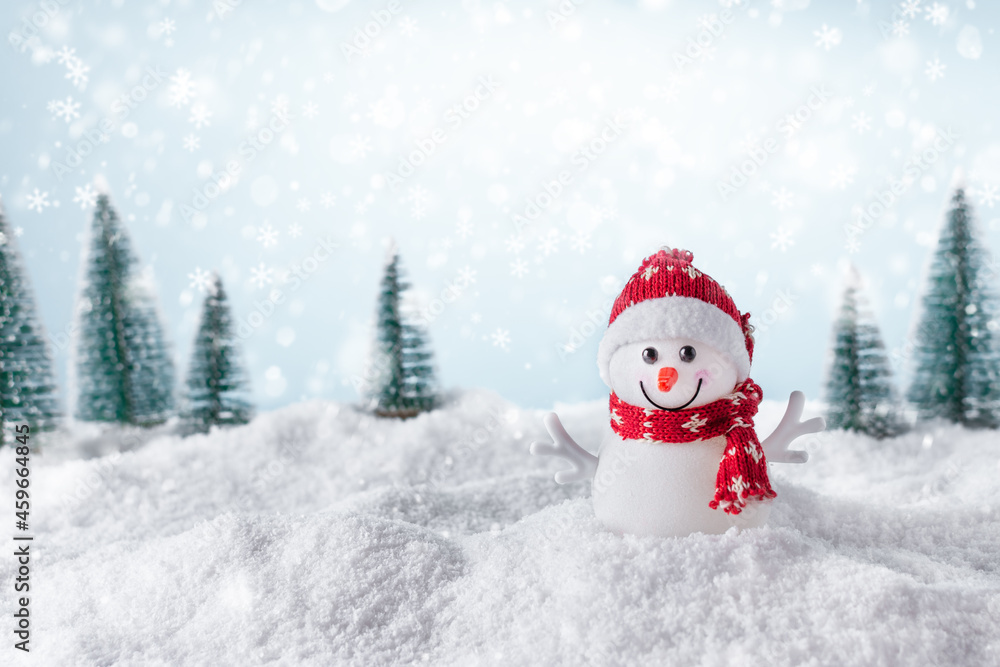 Christmas background with happy snowman standing in winter landscape. Christmas greeting card. Winter time.