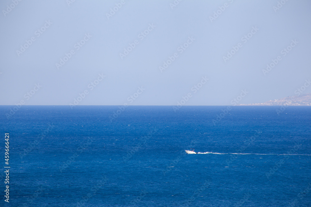 speedboat through the sea with the horizon line