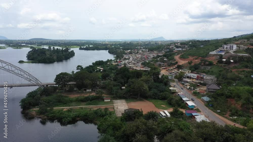 Aerial Adome bridge village Volta river Ghana Africa 4. Main river system in West African country of Ghana. Akosombo dam generating hydroelectricity. Largest man made reservoir by area in the world. Aerial Adome bridge village Volta river Ghana Africa 4. Main river system in West African country of Ghana. Akosombo dam generating hydroelectricity. Largest man made reservoir by area in the world.