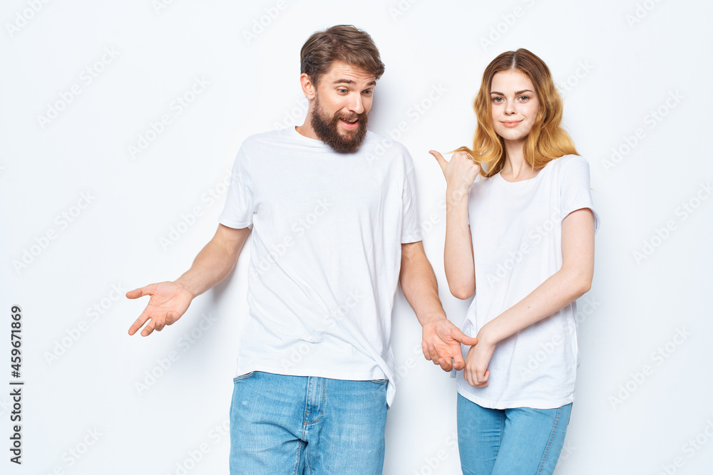 young couple white t-shirts fun lifestyle posing communication young couple white t-shirts fun lifestyle posing communication