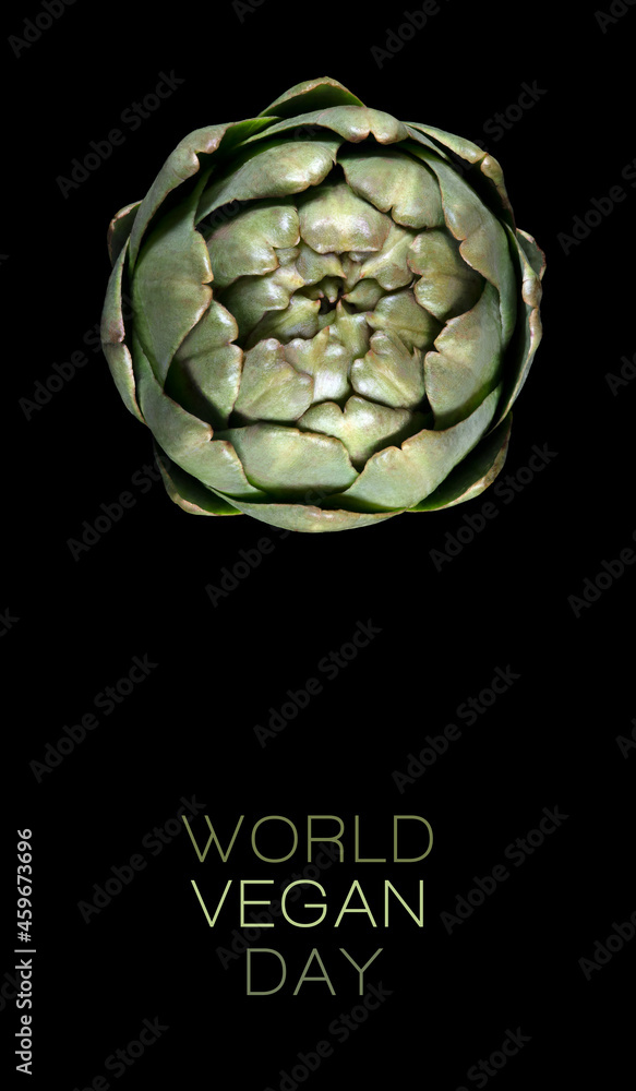 Obraz premium Conceptual design for the World Vegan day with a top view of fresh artichoke on black background. World food day. Vegetarian day