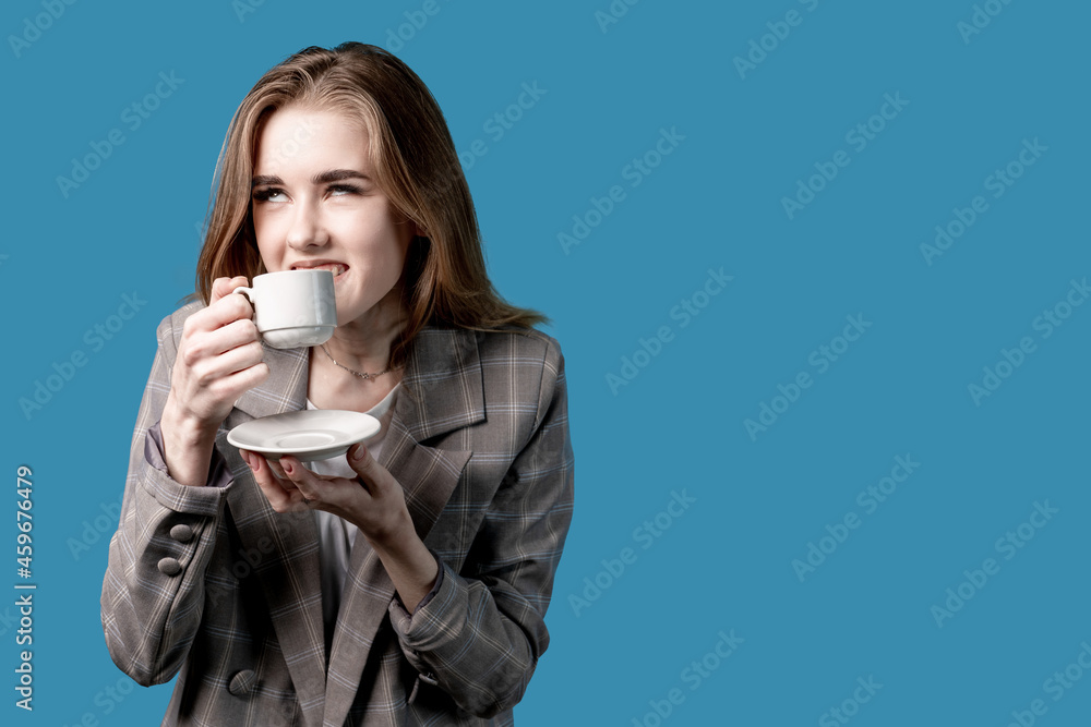Girl enjoying a cup of coffee .blonde in office wear with, Girl enjoying a cup of coffee .blonde in office wear with,